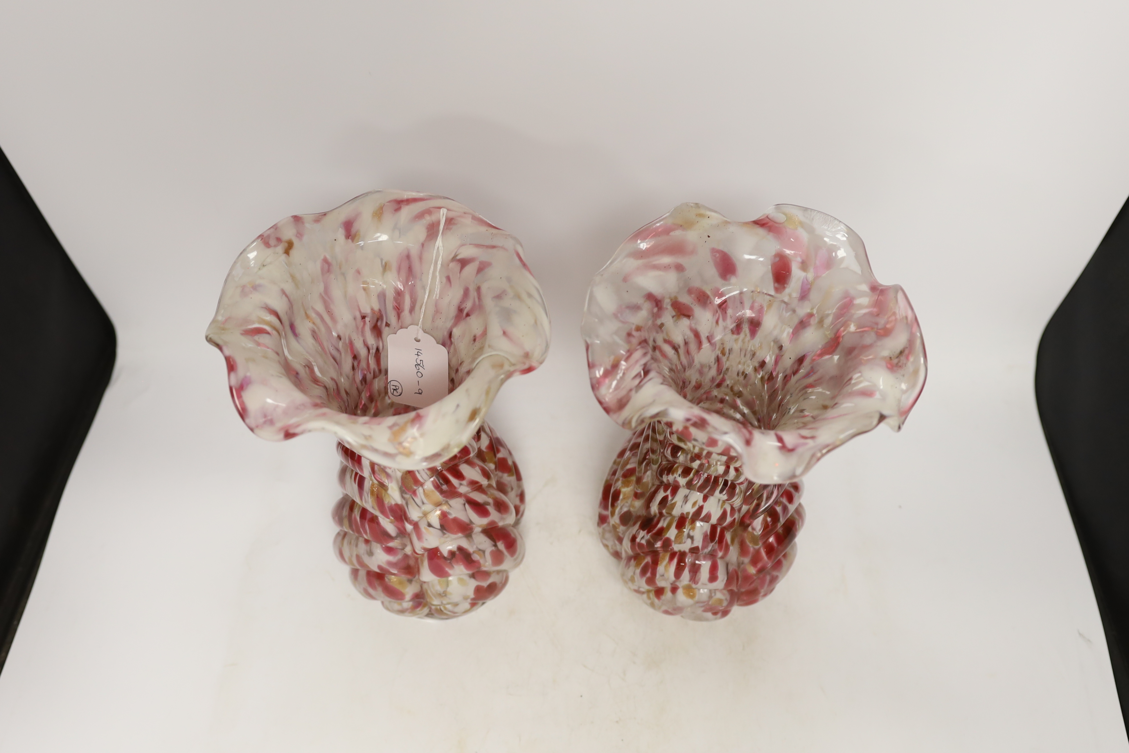 A pair of French red and white glass vases, marked Depose, 29cm high